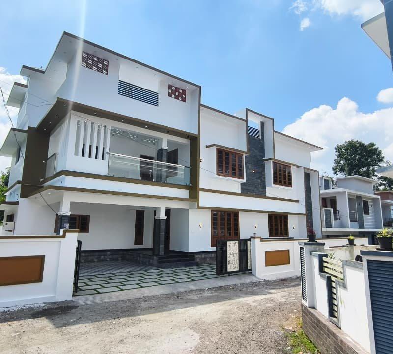 Just 50 meters from the main road | A spacious house with stylish interiors at Kizhakkambalam